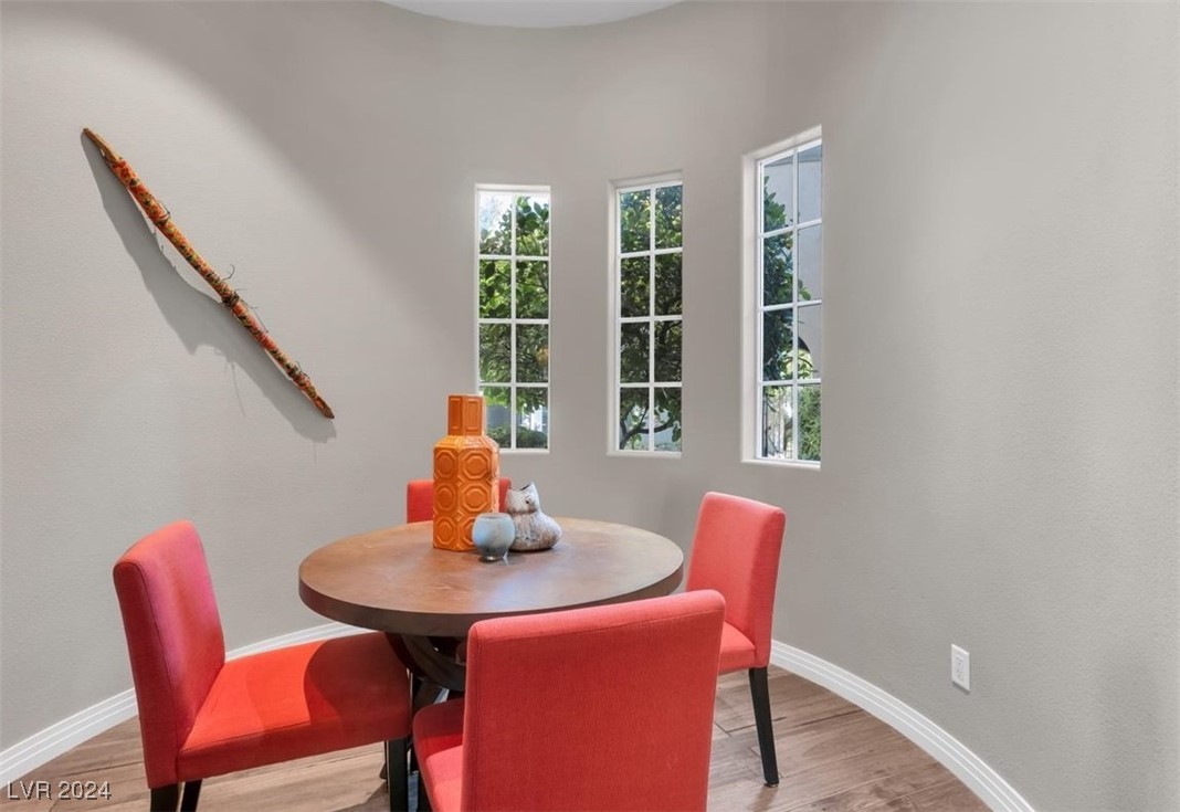 11348 La Madre Ridge Drive Las Vegas, NV 89135 - Photo 22 of 75 Breakfast nook off the kitchen with views to the lush courtyard.