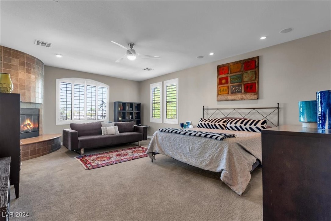 11348 La Madre Ridge Drive Las Vegas, NV 89135 - Photo 28 of 75 Primary Suite w/ updated bathroom surrounds, dual walk-in closets, fireplace & balcony.
