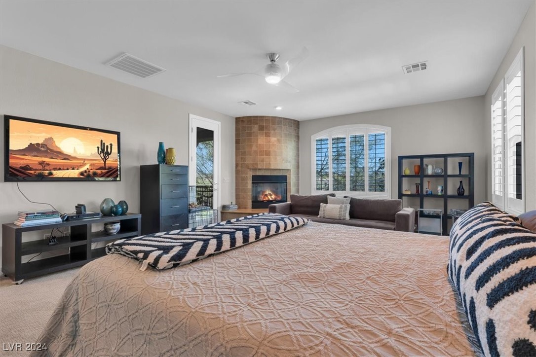 11348 La Madre Ridge Drive Las Vegas, NV 89135 - Photo 30 of 75 Primary Suite w/ updated bathroom surrounds, dual walk-in closets, fireplace & balcony.