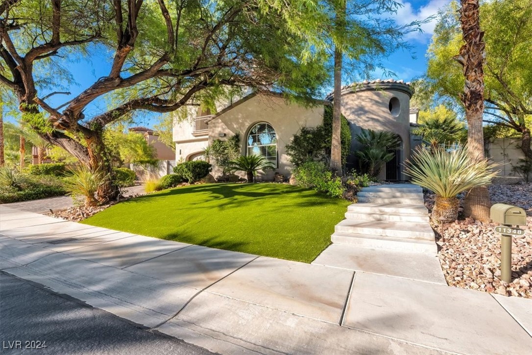 11348 La Madre Ridge Drive Las Vegas, NV 89135 - Photo 3 of 75 One of the largest lots in guard gated Red Rock Country Club East. Newly installed faux lawn, with mature landscaping.