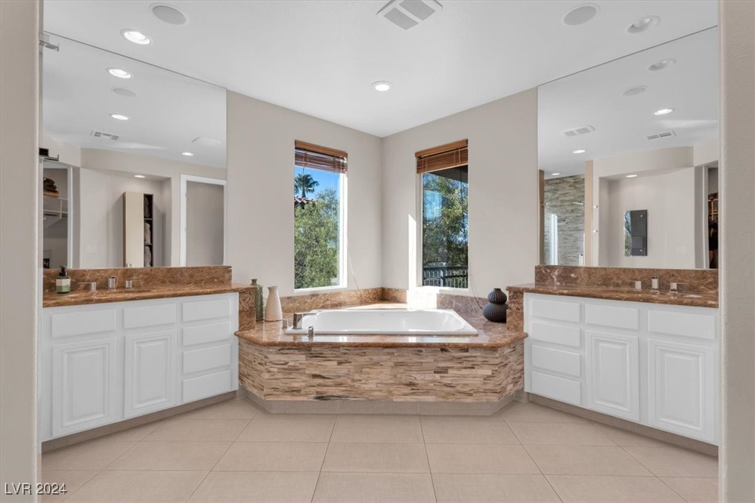 11348 La Madre Ridge Drive Las Vegas, NV 89135 - Photo 33 of 75 Primary Suite w/ updated bathroom surrounds, and dual walk-in closets.