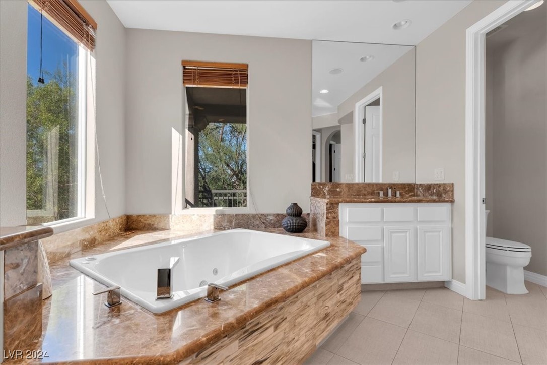 11348 La Madre Ridge Drive Las Vegas, NV 89135 - Photo 35 of 75 Primary Suite w/ updated bathroom surrounds, and dual walk-in closets.