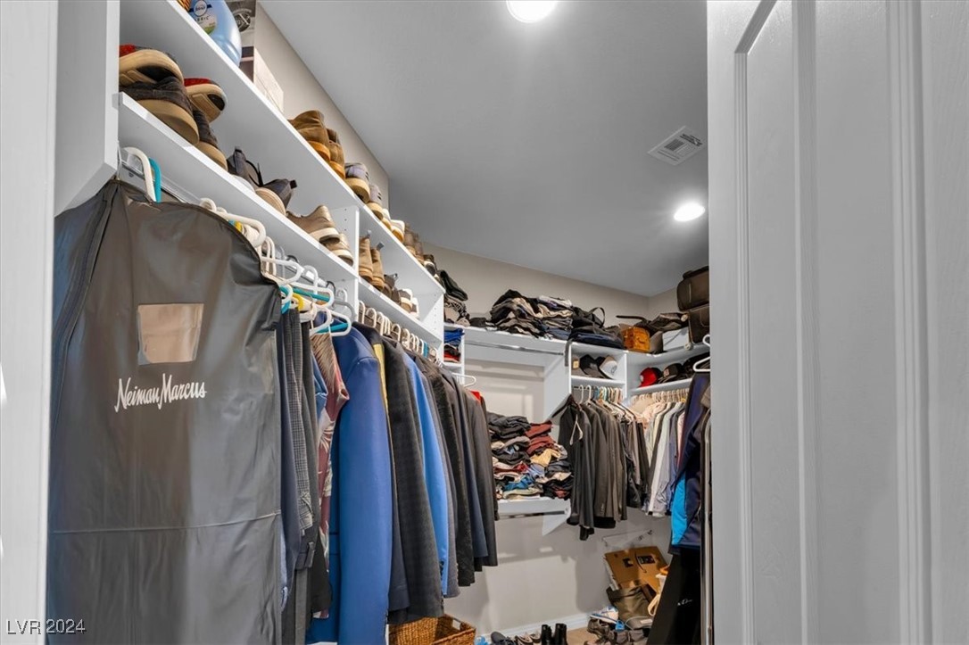 11348 La Madre Ridge Drive Las Vegas, NV 89135 - Photo 37 of 75 Two large walk in closets in primary bedroom suite with built out cabinetry.