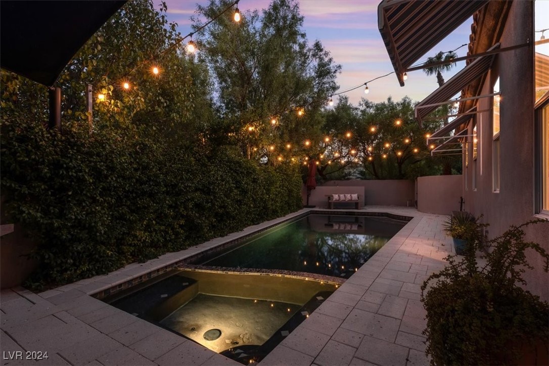11348 La Madre Ridge Drive Las Vegas, NV 89135 - Photo 45 of 75 Secluded Pool & Spa with tranquil lighting, updated tile, and shellock paver decking.