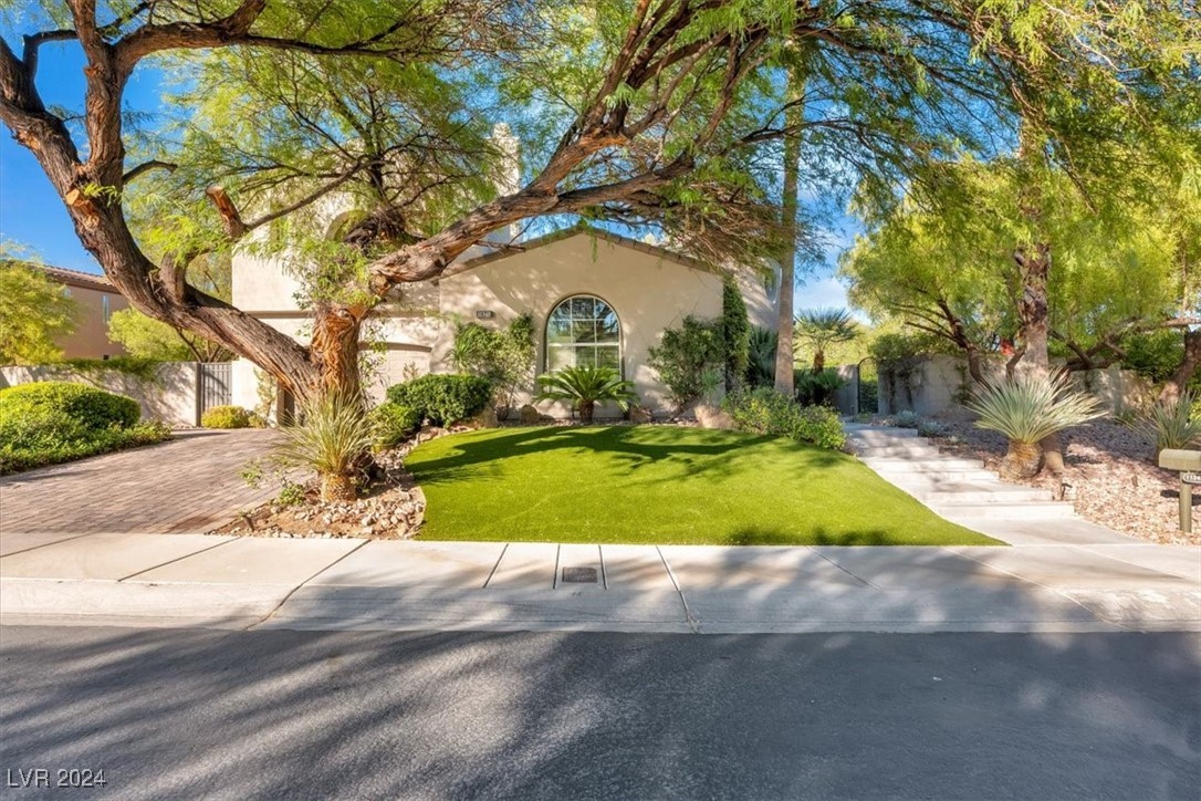 11348 La Madre Ridge Drive Las Vegas, NV 89135 - Photo 58 of 75 One of the largest lots in guard gated Red Rock Country Club East. Newly installed faux lawn, with mature landscaping.