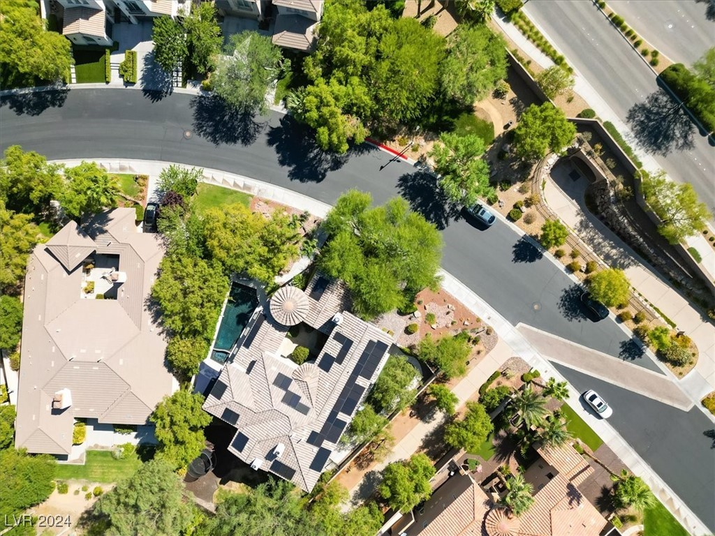 11348 La Madre Ridge Drive Las Vegas, NV 89135 - Photo 62 of 75 Uniquely located across from a park, and cart path to the West of the home so your neighbor is farther away, and the neighbor to the East is a lower one story home for added privacy in your yard.