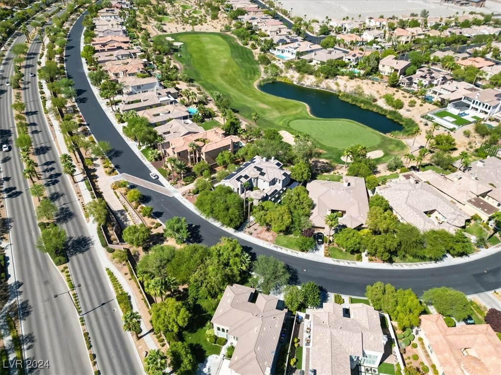 11348 La Madre Ridge Drive Las Vegas, NV 89135 - Photo 8 of 75 One of the largest lots in guard gated Red Rock Country Club East, golf front on the 10th hole of Private Mountain Course, w/ golf & lake views.