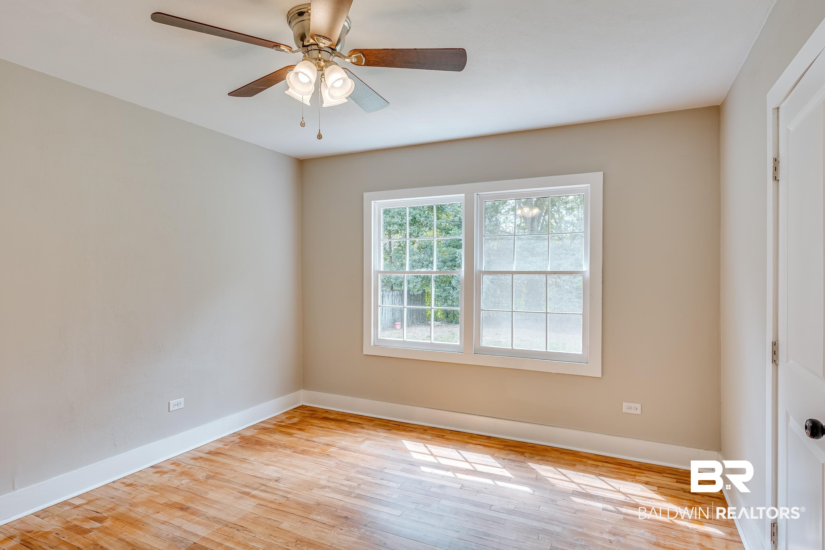 8001 16th Street Irvington, AL 36544 - Photo 21 of 35 Spare room with light wood finished floors and a ceiling fan