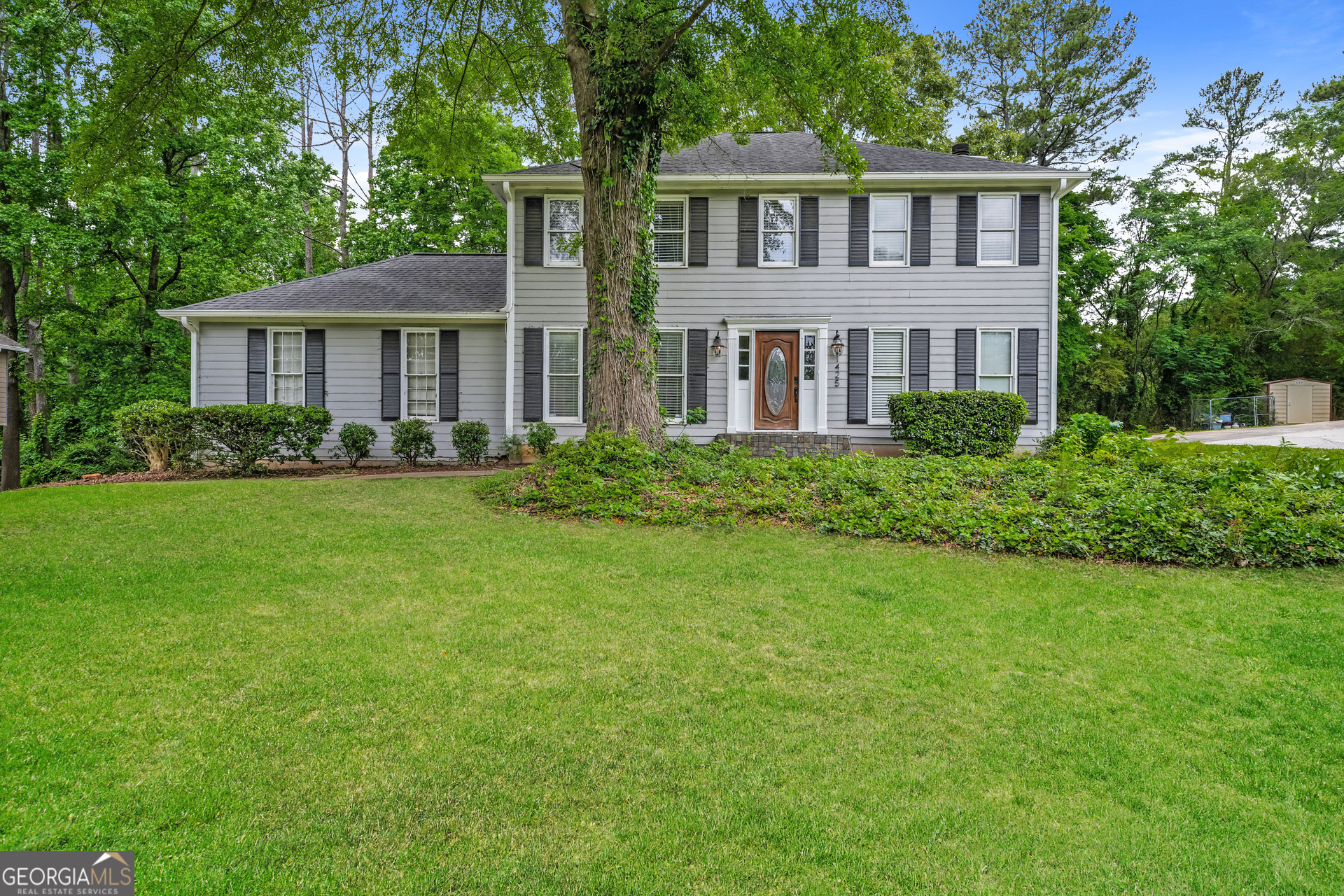 a front view of a house with a yard