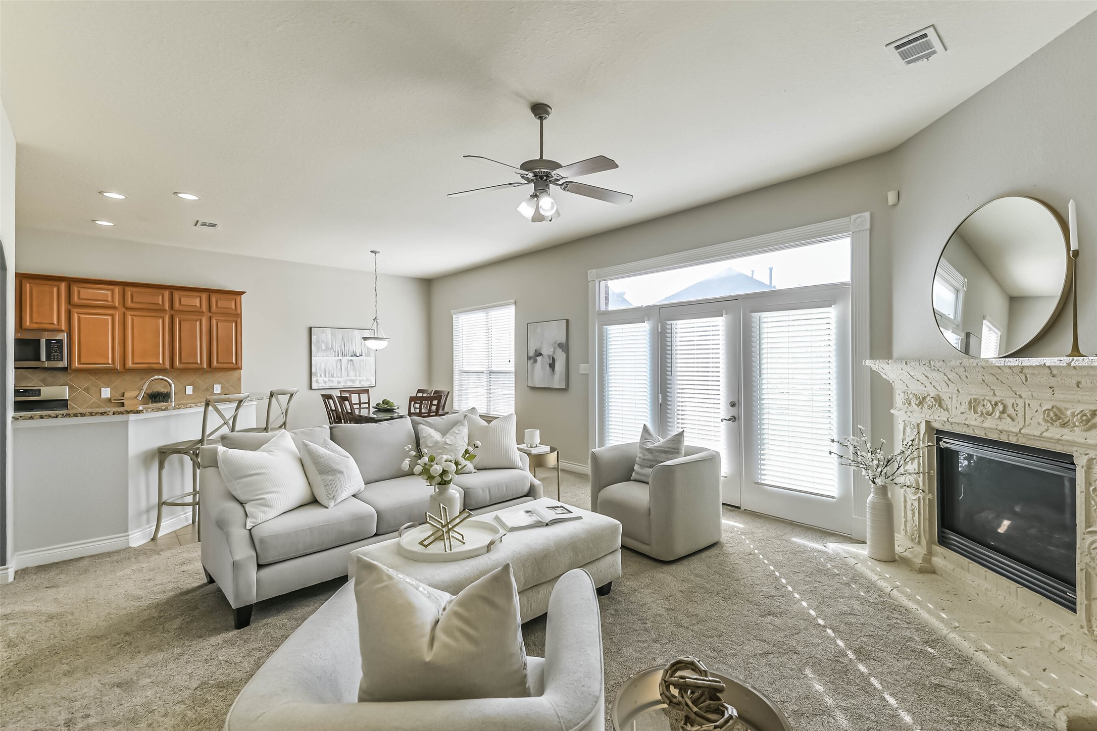 19022 Greenleaf Ridge Court Cypress, TX 77429 - Photo 13 of 47 a living room with furniture a fireplace and a chandelier