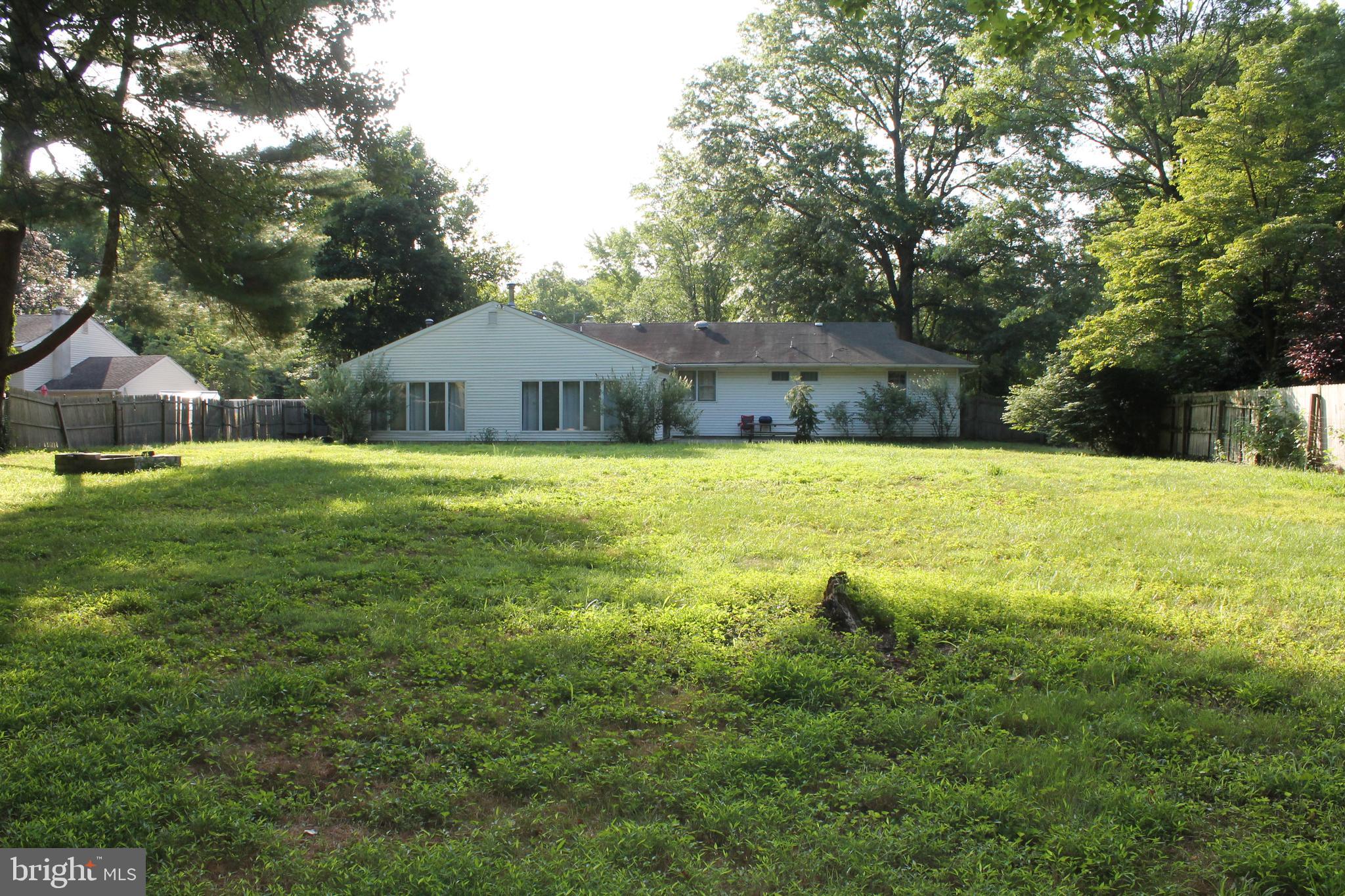 26 Taunton Road Medford, NJ 08055 - Photo 24 of 24 a white house with a big yard and large trees