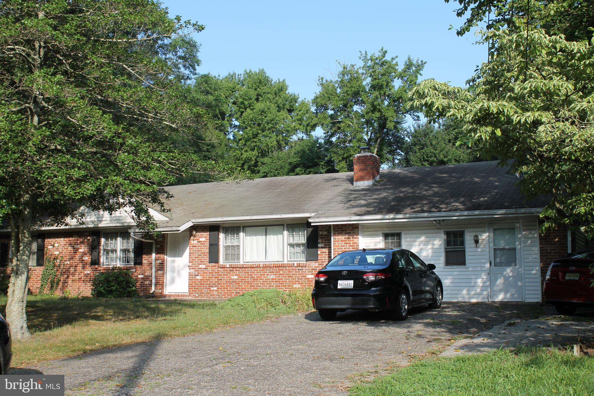 26 Taunton Road Medford, NJ 08055 - Photo 3 of 24 a car parked in front of a house