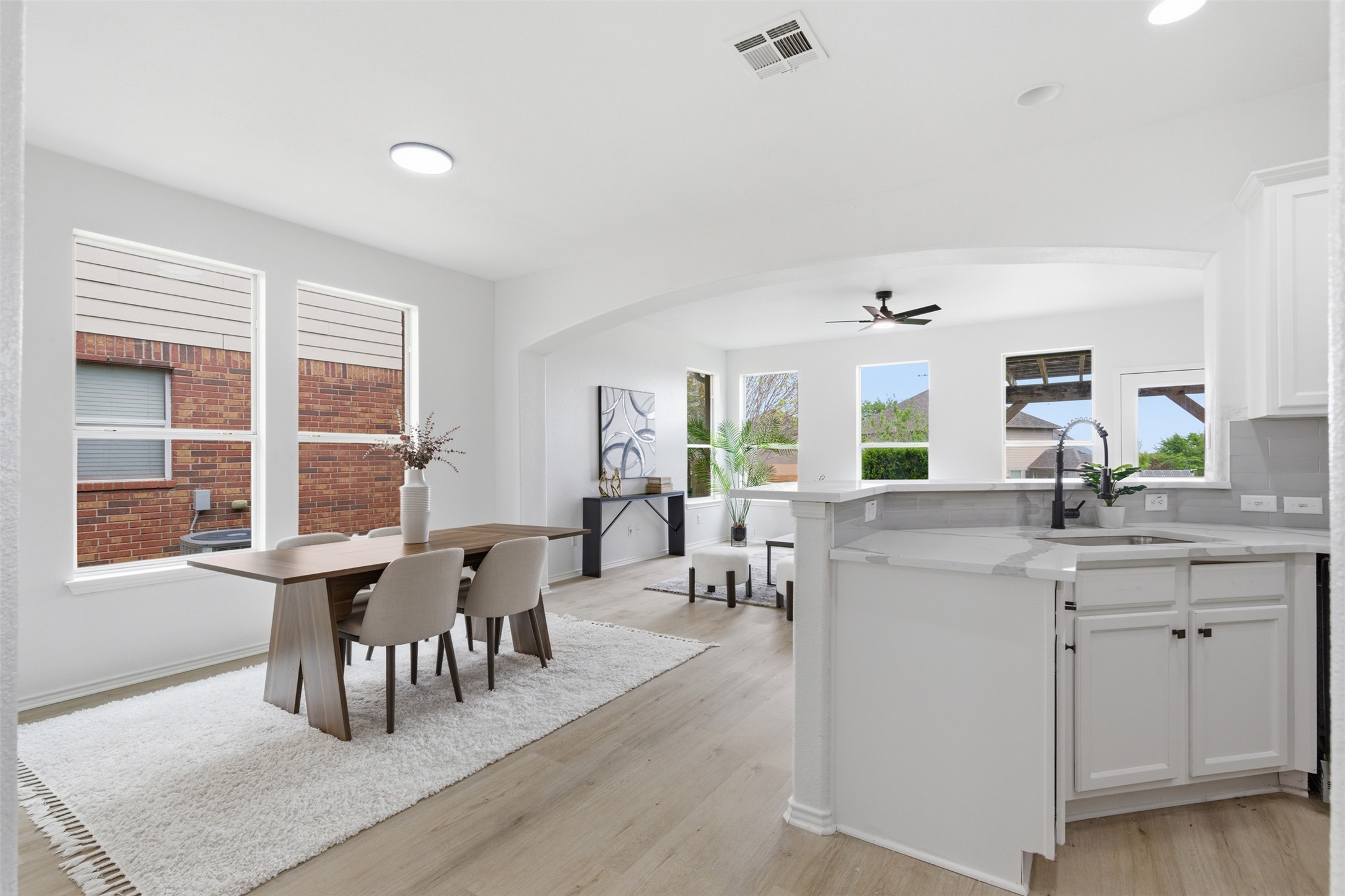 461 Hot Spring Valley Buda, TX 78610 - Photo 10 of 25 The property features light wood flooring, white walls, and an open layout