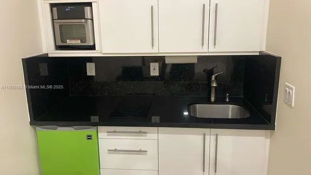 a bathroom with a sink and a window