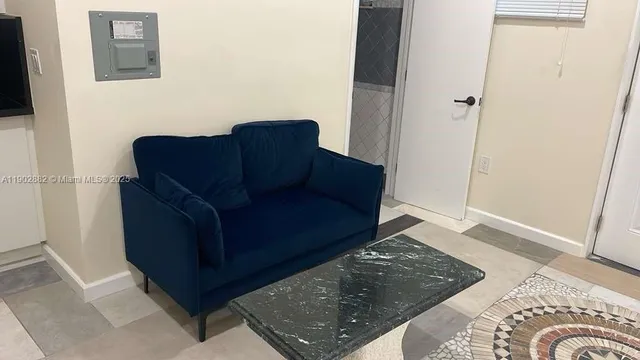 a living room with furniture and a rug