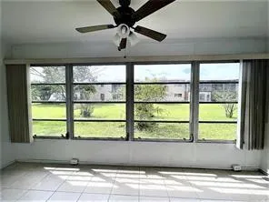a view of empty room with windows