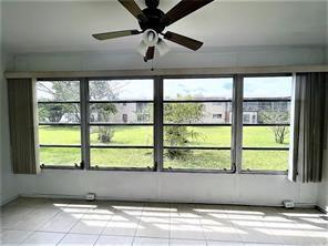 7300 Northwest 5th Court, Unit 106 Margate, FL 33063 - Photo 13 of 13 a view of empty room with windows