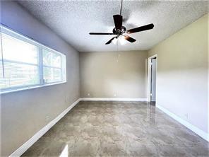 7300 Northwest 5th Court, Unit 106 Margate, FL 33063 - Photo 7 of 13 a view of an empty room with a window