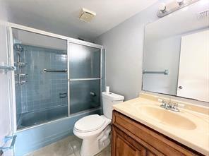 7300 Northwest 5th Court, Unit 106 Margate, FL 33063 - Photo 9 of 13 a bathroom with a sink toilet and shower