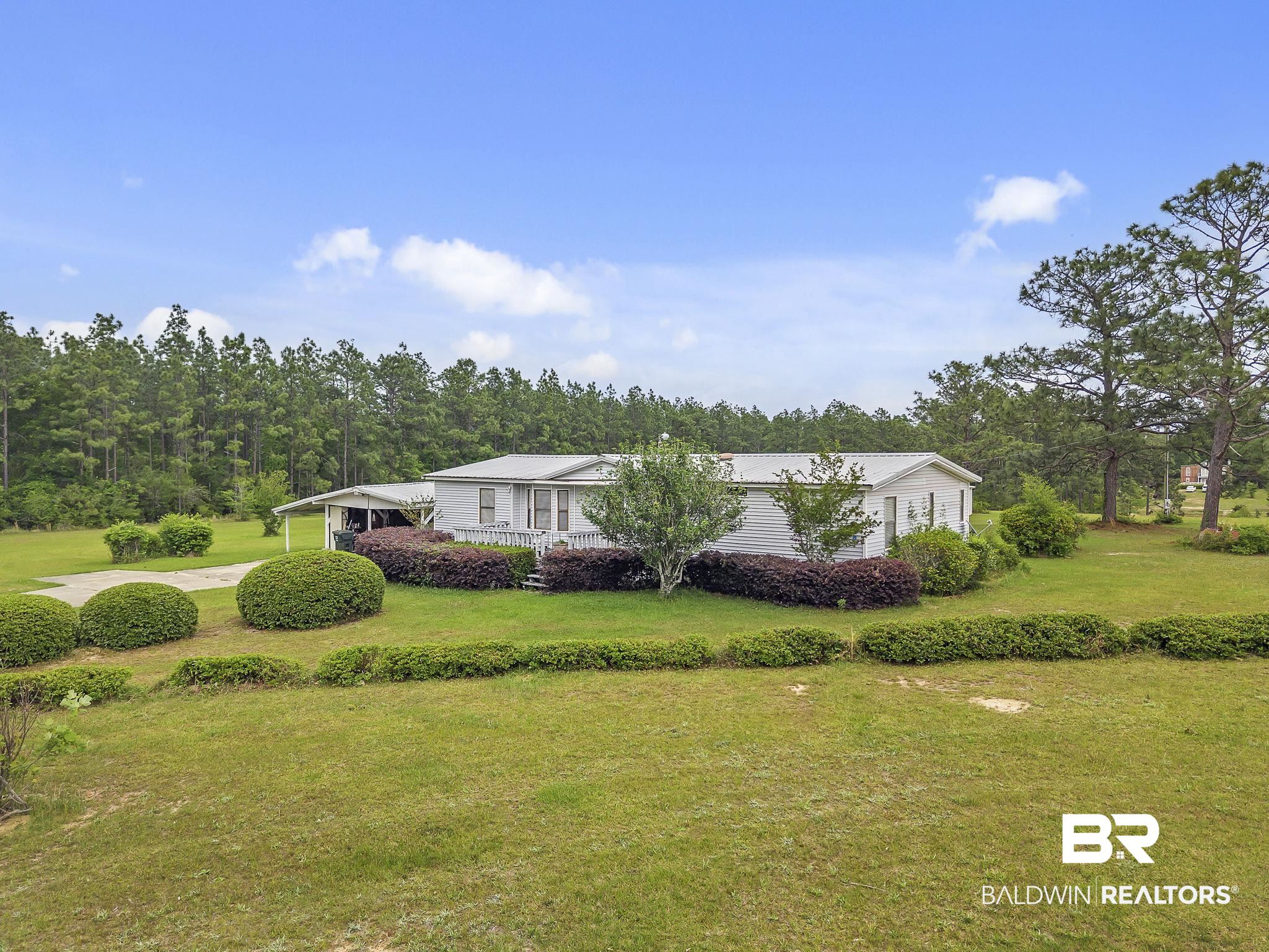 29792 County Road 65 Loxley, AL 36551 - Photo 10 of 39 View of front of home with a front lawn