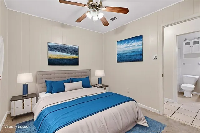 a bedroom with a large bed and a window