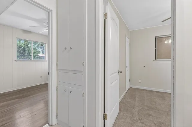 a view of a house with yard and tree s