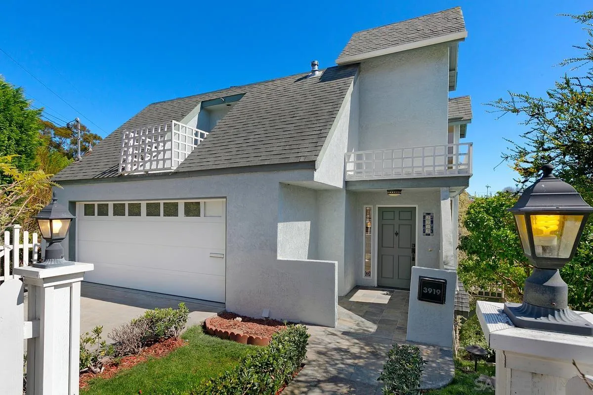 3919 Pringle Street San Diego, CA 92103 - Photo 11 of 37 a front view of a house with a garden