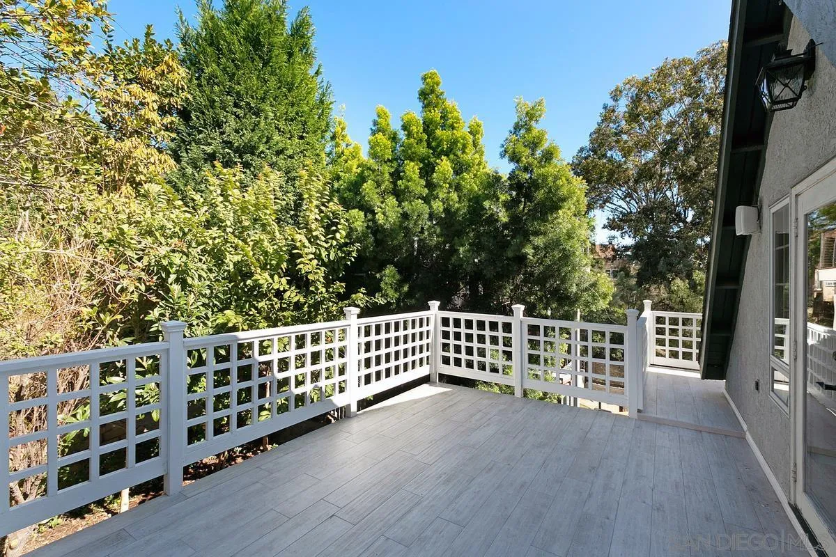 3919 Pringle Street San Diego, CA 92103 - Photo 15 of 37 a view of a deck with wooden fence and floor