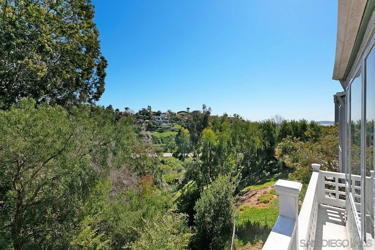 3919 Pringle Street San Diego, CA 92103 - Photo 17 of 37 a view of a balcony with wooden floor and fence