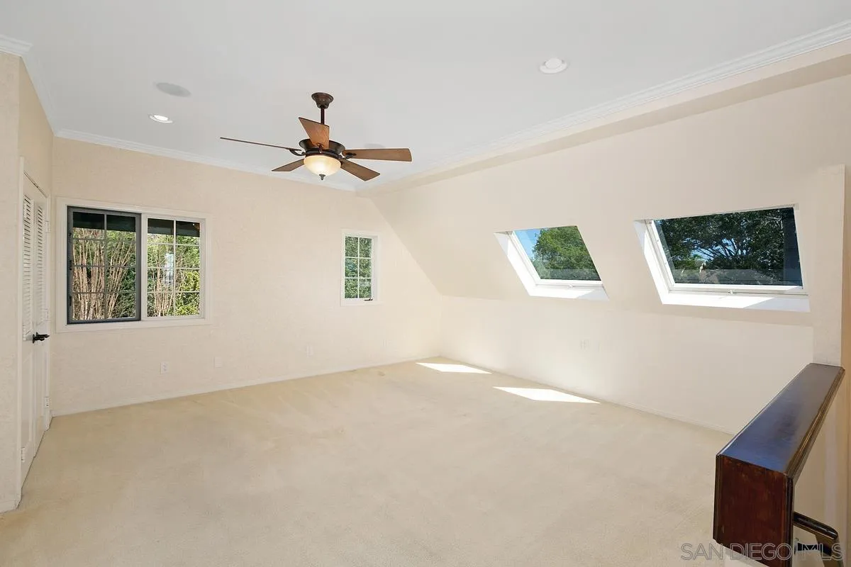 3919 Pringle Street San Diego, CA 92103 - Photo 26 of 37 a view of room with window and ceiling fan