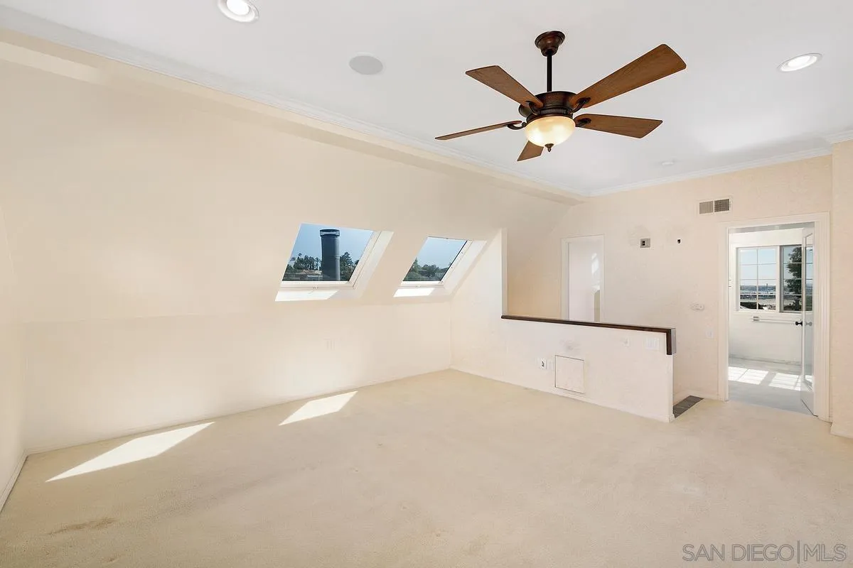 3919 Pringle Street San Diego, CA 92103 - Photo 27 of 37 a view of a kitchen with a ceiling fan
