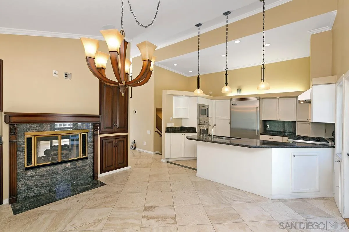 3919 Pringle Street San Diego, CA 92103 - Photo 3 of 37 a kitchen with stainless steel appliances granite countertop a sink a oven and a refrigerator