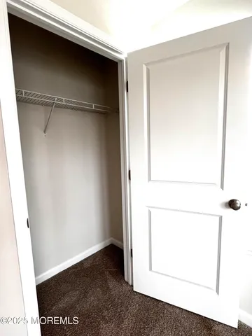 an empty room with a empty space and windows