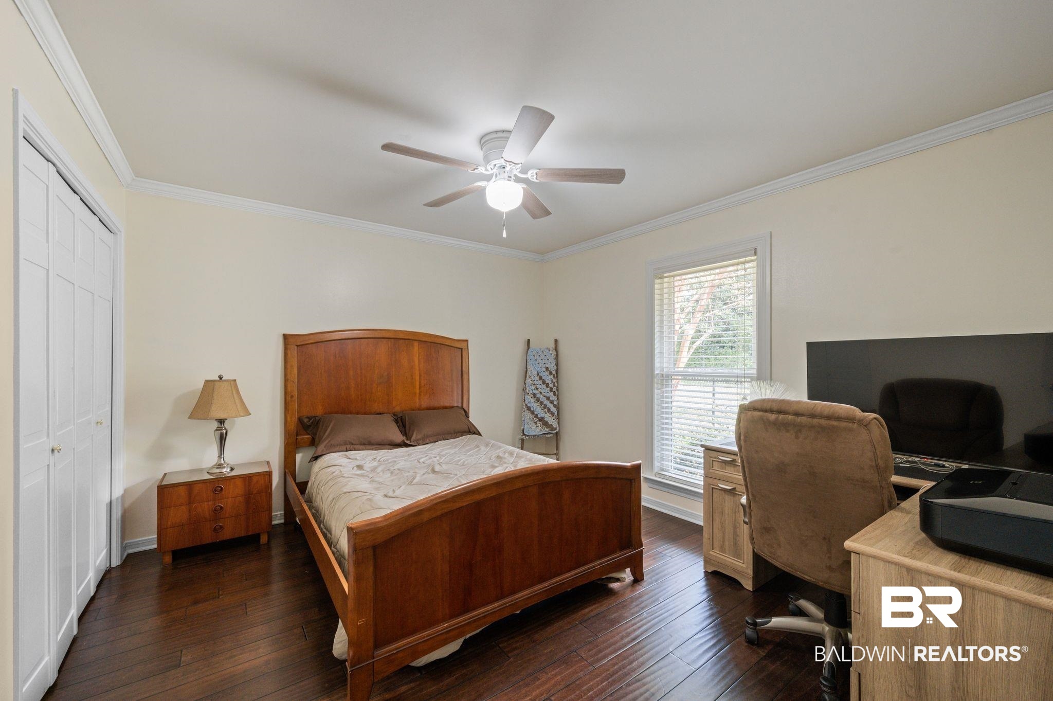 20037 County Road 33 Fairhope, AL 36532 - Photo 26 of 79 Bedroom with a closet, ceiling fan, dark wood-type flooring, and ornamental molding