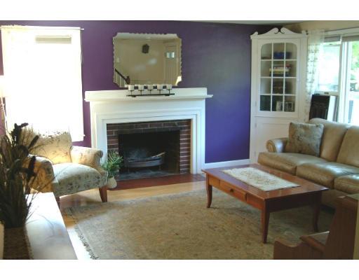 9 Myrna Road Lexington, MA 02420 - Photo 2 of 7 a living room with furniture and a fireplace