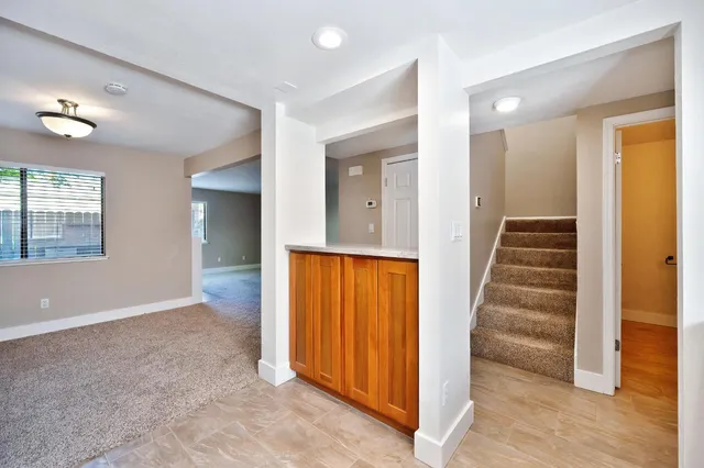 wooden view of a hallway with closet and wooden floor