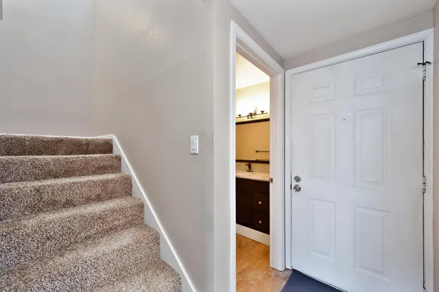 a view of front door with wooden floor