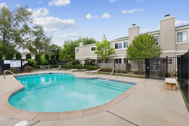 a view of a swimming pool with a patio