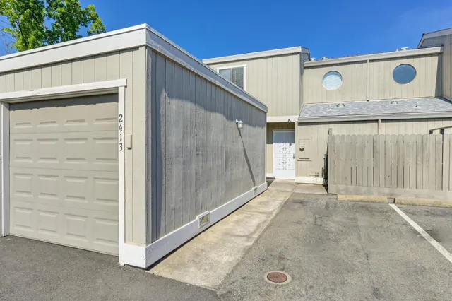 a front view of a house with garage