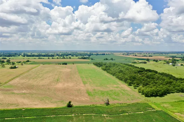 a view of a field with an outdoor space