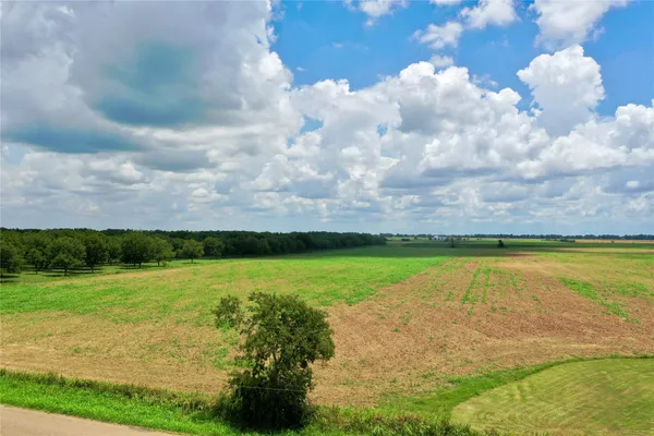 a view of a lake with a big yard