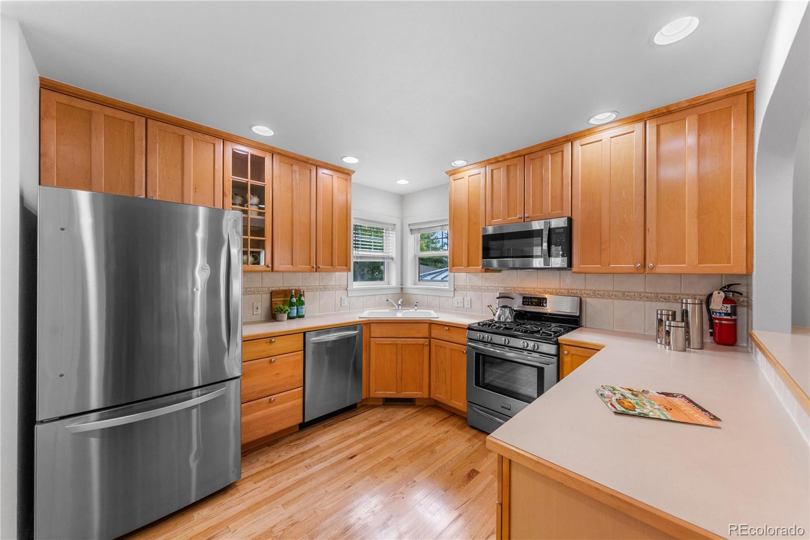 3056 8th Street Boulder, CO 80304 - Photo 11 of 45 a kitchen with stainless steel appliances granite countertop a refrigerator stove top oven and sink