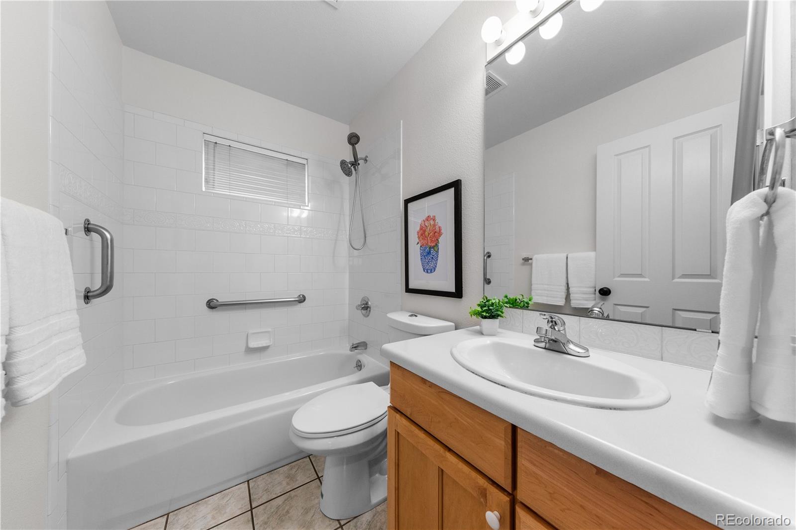 3056 8th Street Boulder, CO 80304 - Photo 13 of 45 a bathroom with a sink a toilet and shower