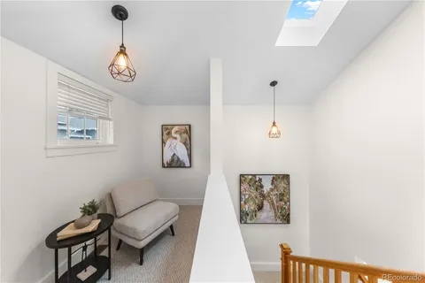 a spacious bedroom with a bed and a window