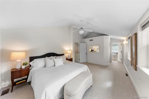 a large bathroom with a tub shower and sink