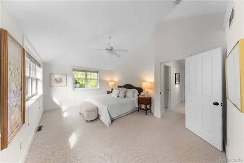 a spacious bathroom with a granite countertop tub sink and mirror