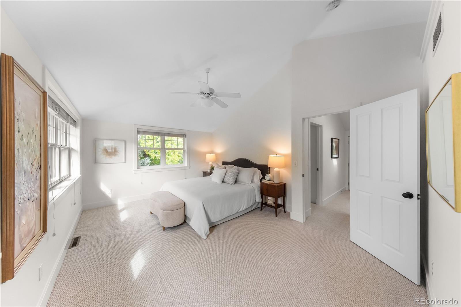 3056 8th Street Boulder, CO 80304 - Photo 16 of 45 a spacious bedroom with a bed and a window