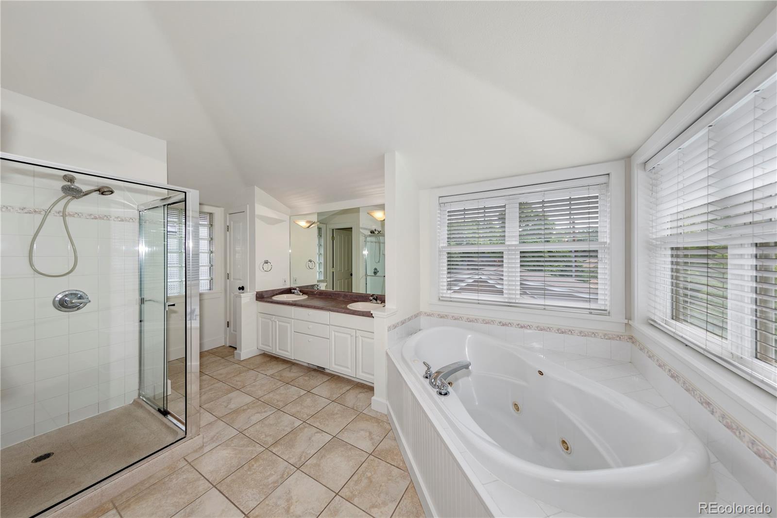 3056 8th Street Boulder, CO 80304 - Photo 17 of 45 a large bathroom with a tub shower and sink