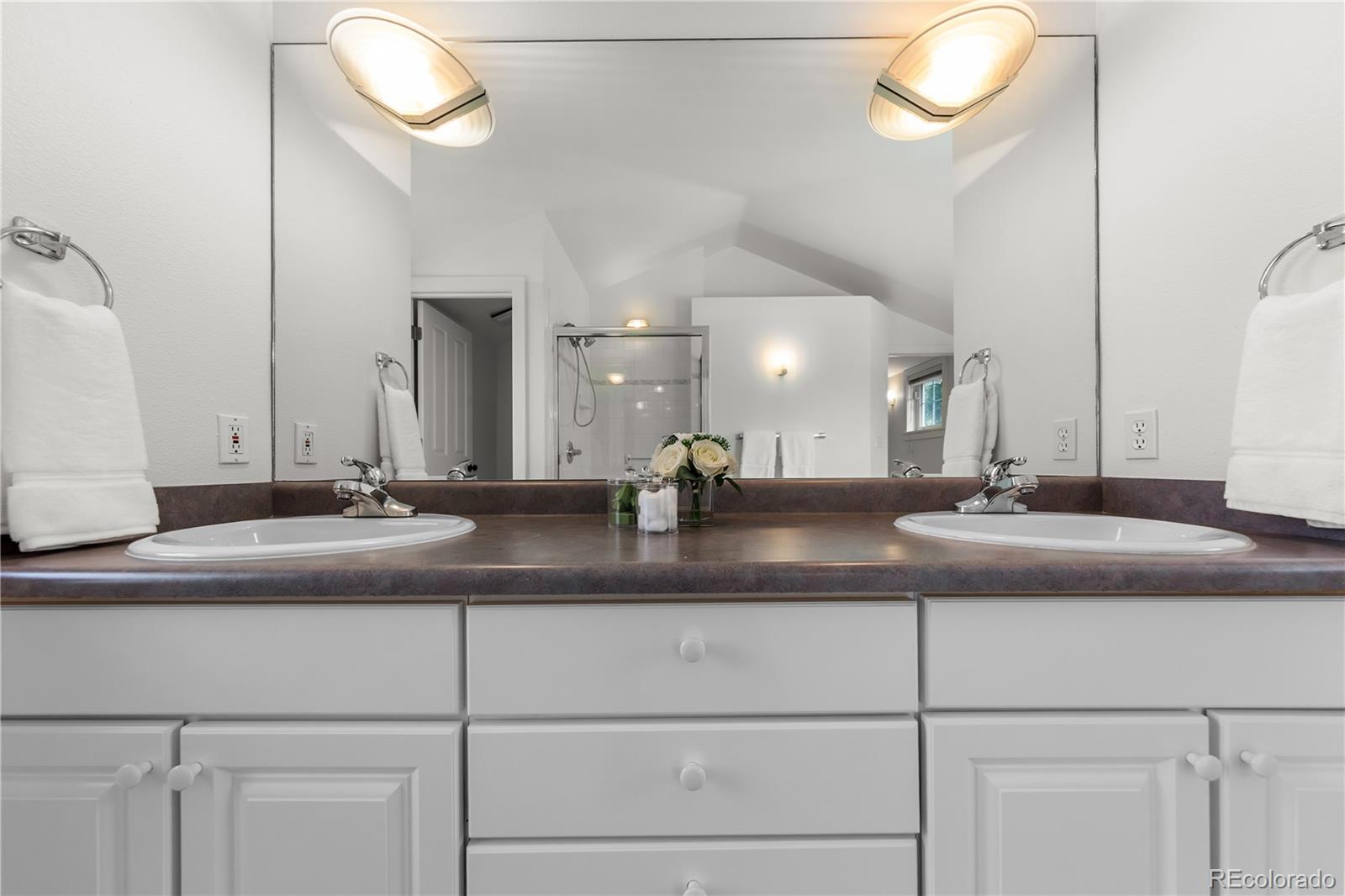 3056 8th Street Boulder, CO 80304 - Photo 20 of 45 a bathroom with a double vanity sink and a mirror