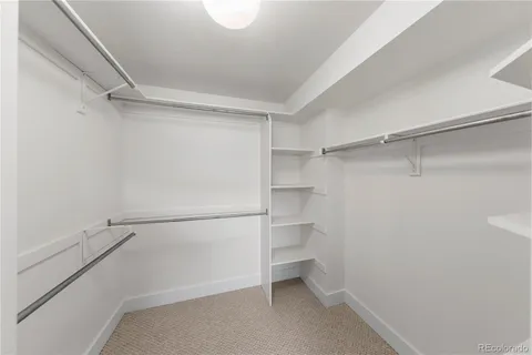 an empty room with a empty space and windows